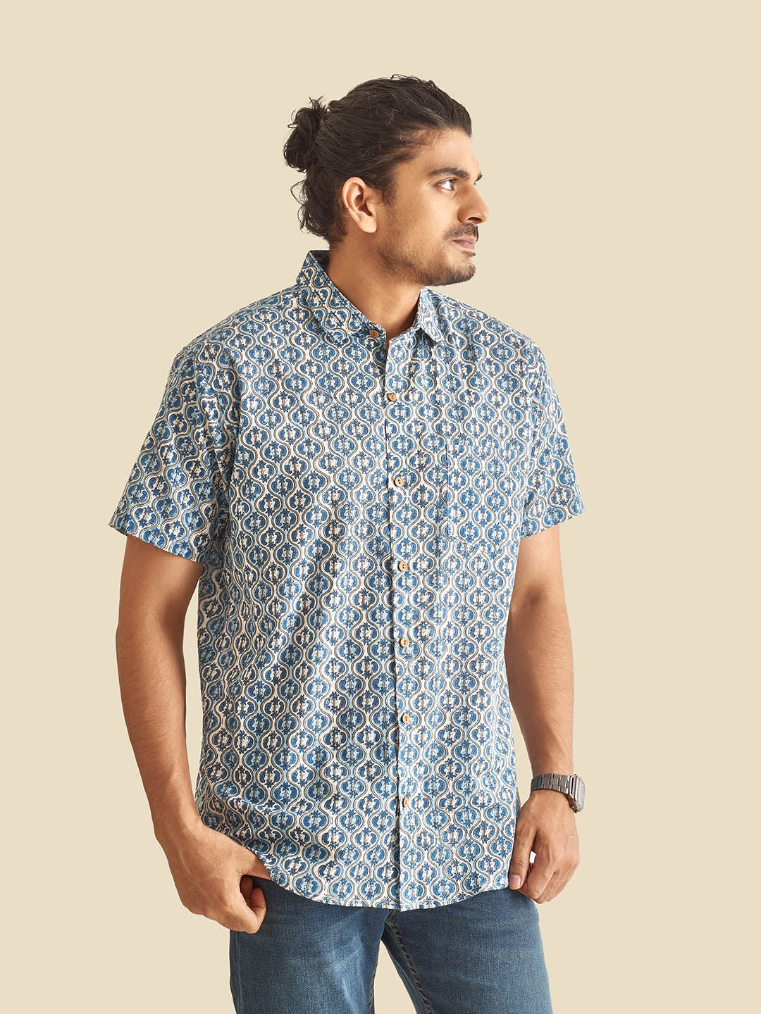 Model Facing sideways wearing Blue and White Ethnic Block Printed Holiday Halfsleeves Cotton Shirt by Brand Patrah