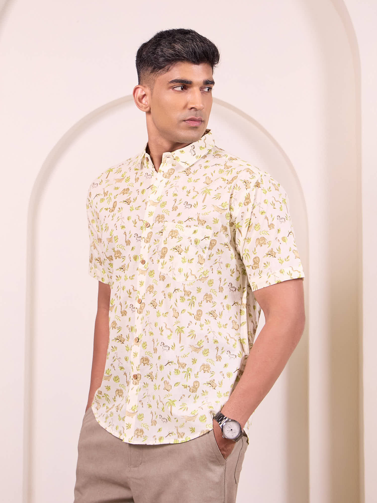 Side profile of man in earthy safari print cotton shirt