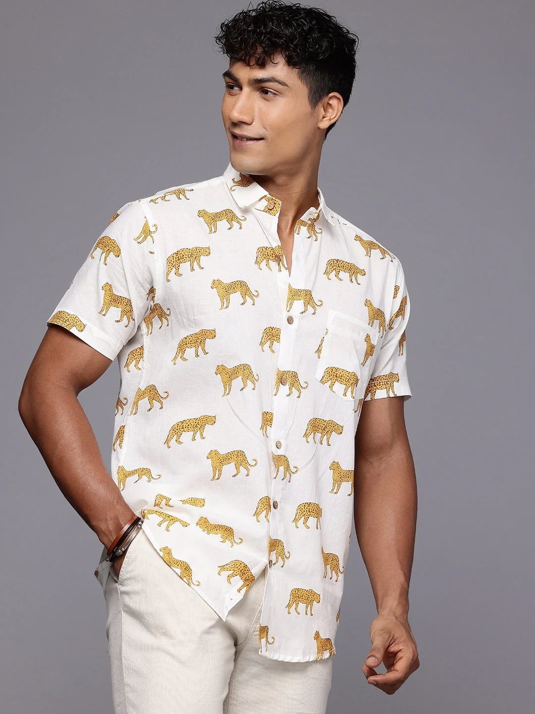 Side profile of man in cheetah print shirt for holiday styling