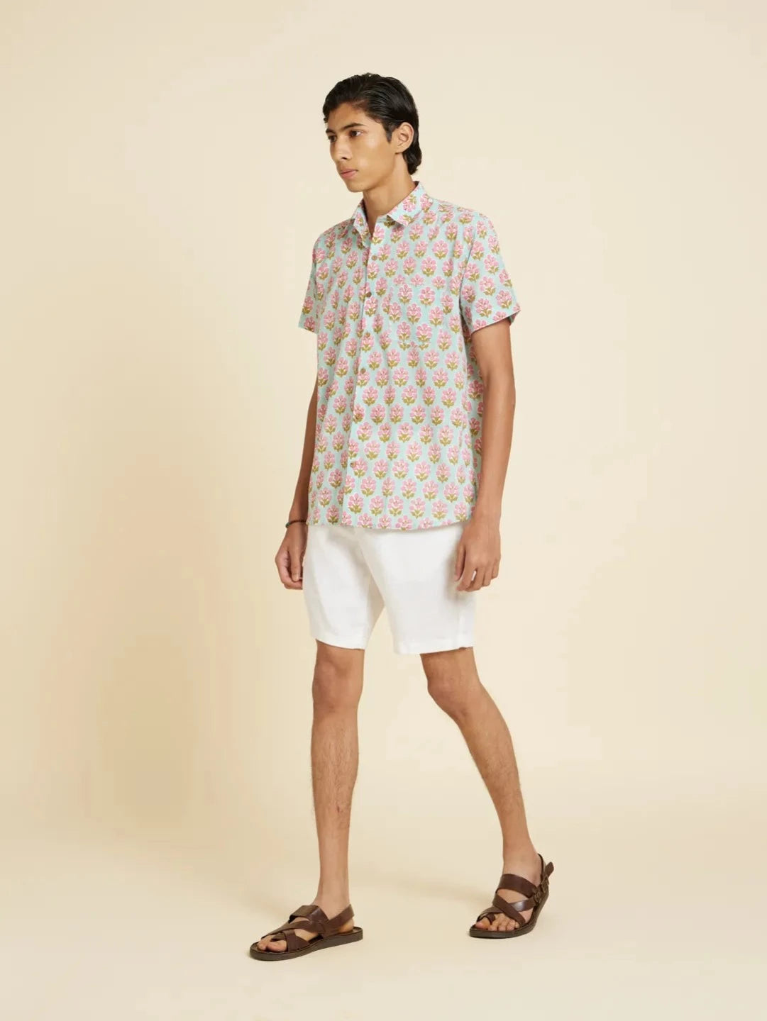 Model Facing sideways wearing Block Printed Quirky Unisex Shirt by Brand Patrah