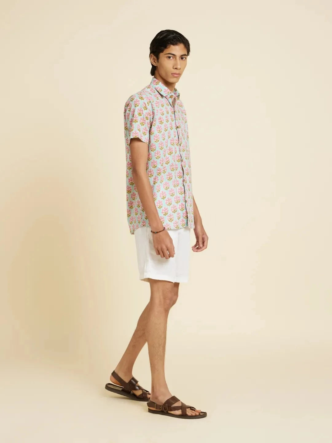 Model Facing sideways wearing Block Printed Quirky Unisex Shirt by Brand Patrah