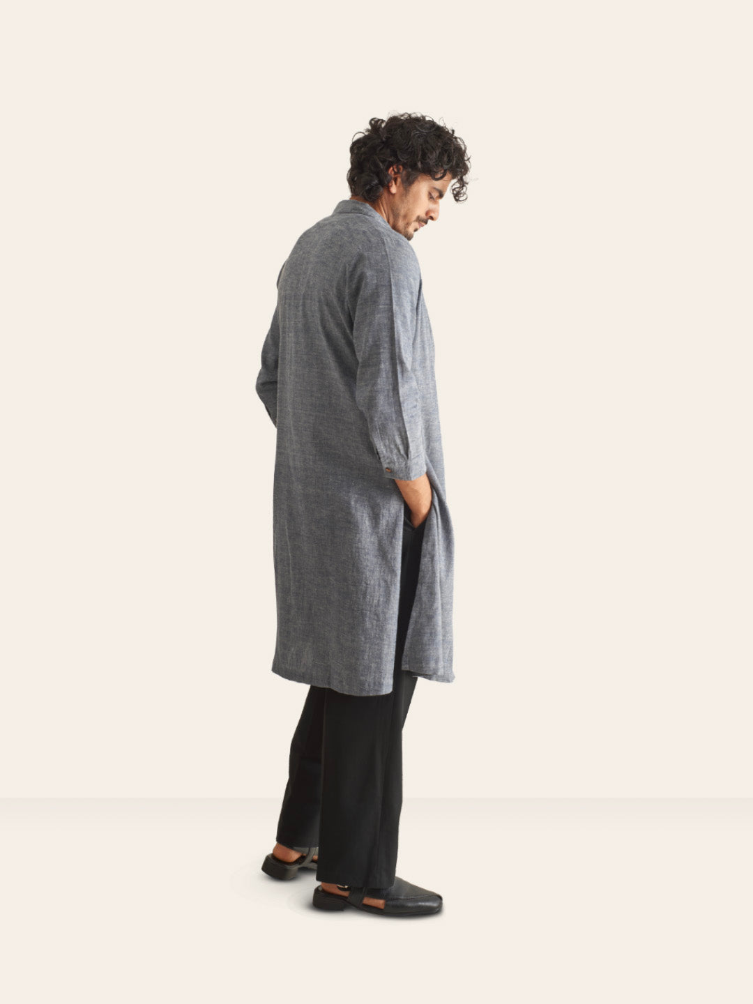 Model facing backwards wearing Grey Handwoven Overlay Kurta Shirt by Brand Patrah