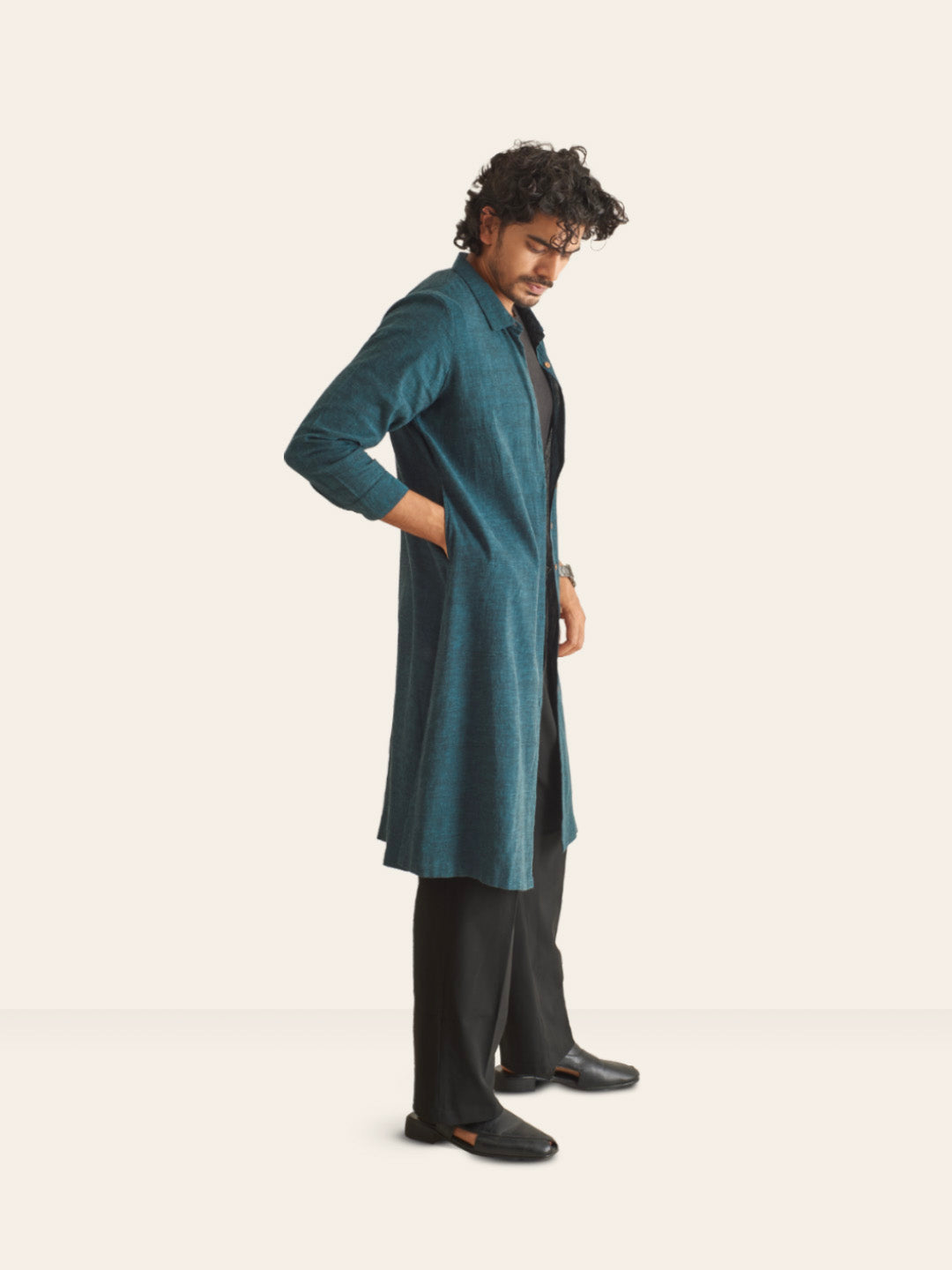 Model Facing sideways wearing Dark Pine Handwoven Overlay Kurta Shirt by Brand Patrah