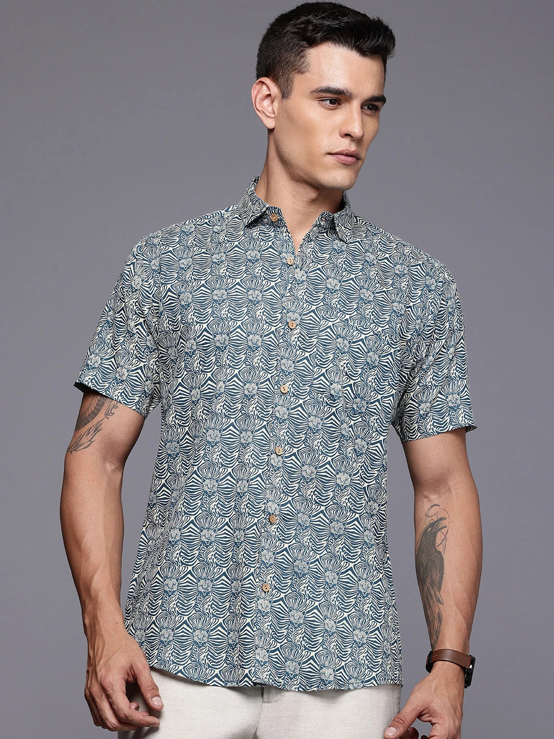Man wearing a printed short sleeves shirt.
