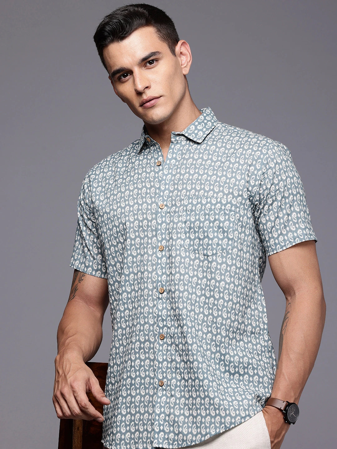 Man wearing a graphite printed shirt with half sleeves