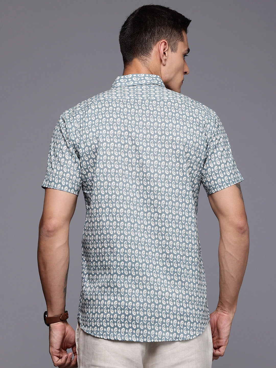 Man wearing a printed short-sleeve shirt