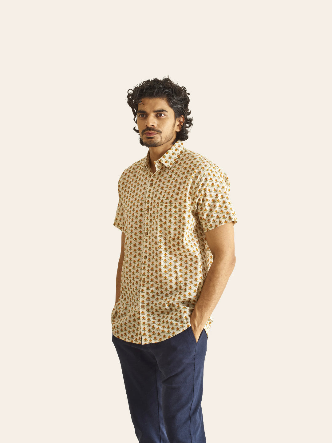 Model Facing sideways wearing Mustard Bud Printed Cotton Shirt by Brand Patrah