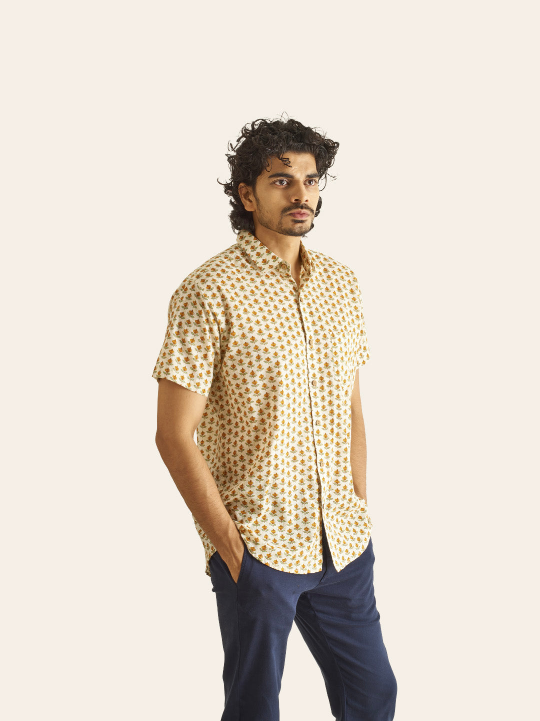 Model Facing sideways wearing Mustard Bud Printed Cotton Shirt by Brand Patrah