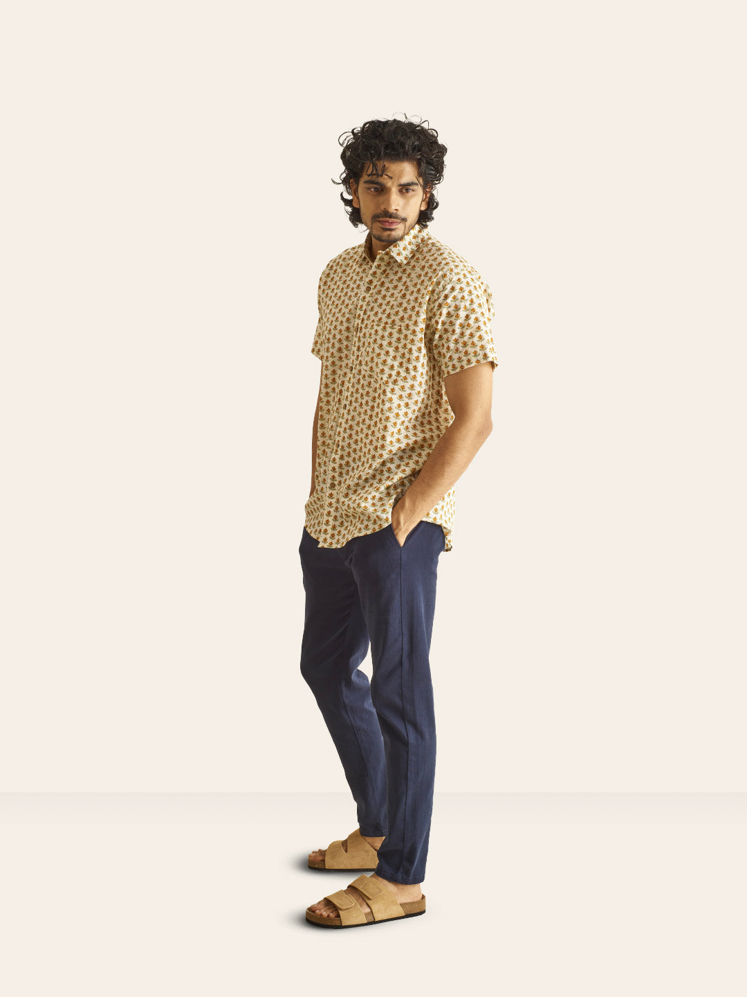 Model Facing sideways wearing Mustard Bud Printed Cotton Shirt by Brand Patrah