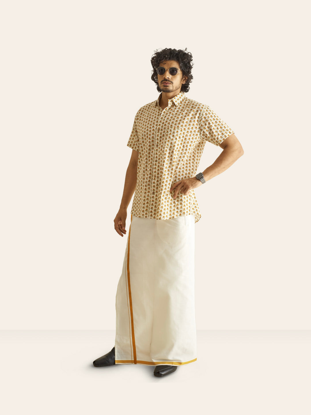 Model Facing sideways wearing Mustard Bud Printed Cotton Shirt by Brand Patrah