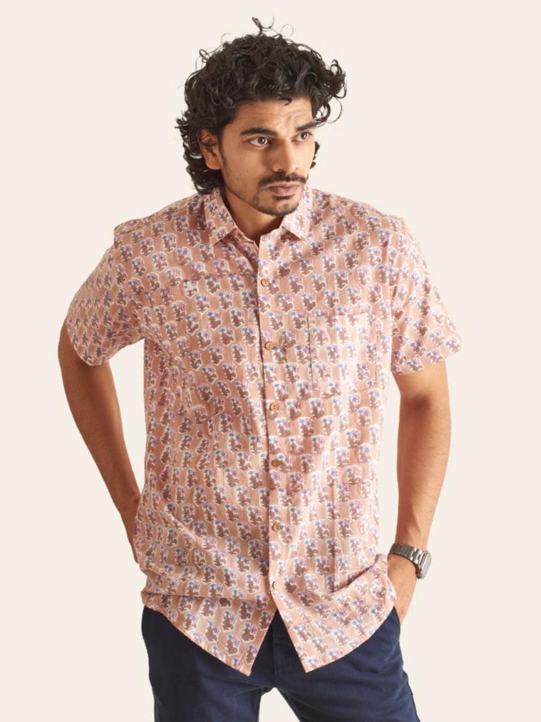 Model Facing sideways wearing Dusty Pink Floral Handblock Printed Cotton Shirt by Brand Patrah