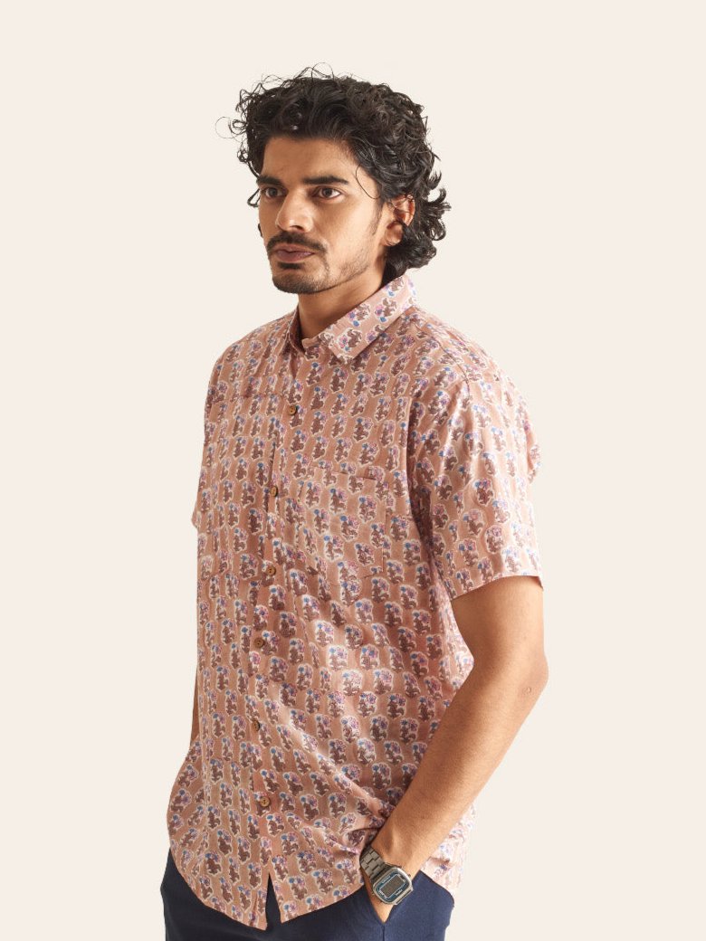 Model Facing sideways wearing Dusty Pink Floral Handblock Printed Cotton Shirt by Brand Patrah