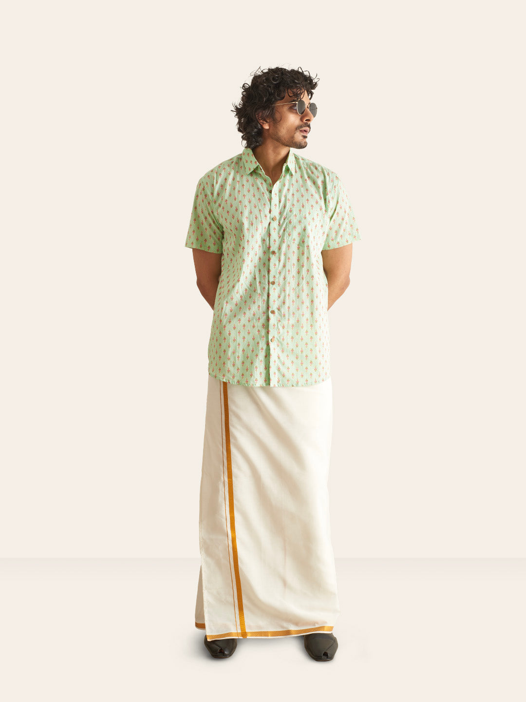 Model Facing sideways wearing Mint Green Printed Cotton Shirt by Brand Patrah