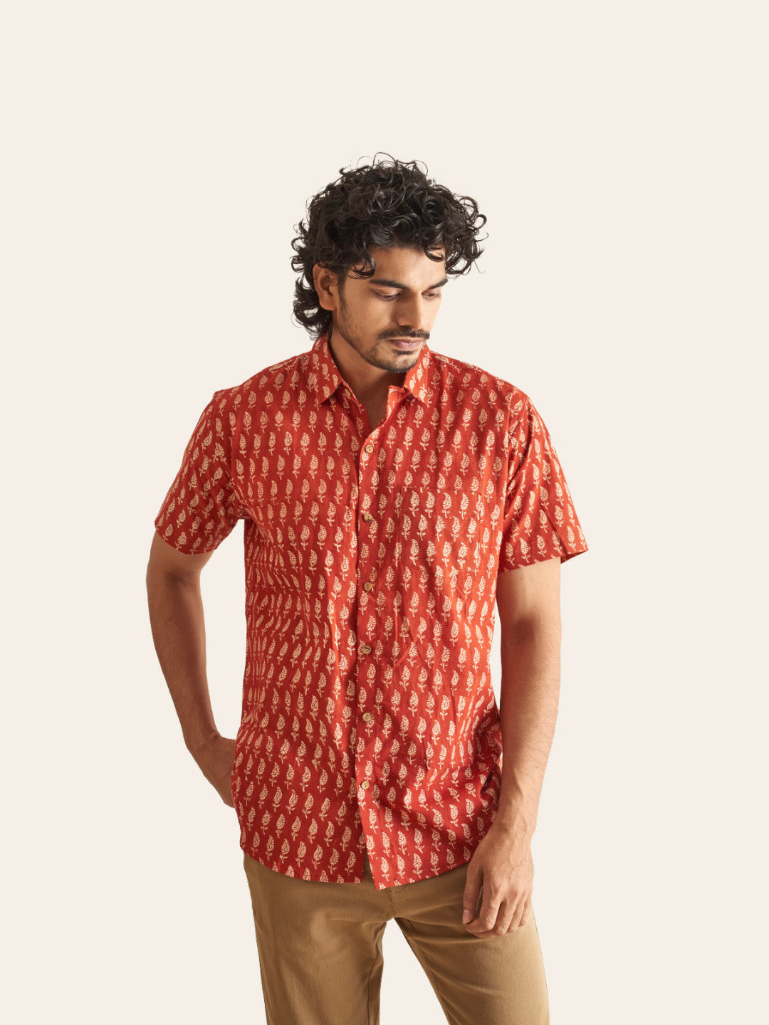 Model Facing sideways wearing Natural Dye Red Ethnic Motif Handblock Printed Cotton Shirt by Brand Patrah