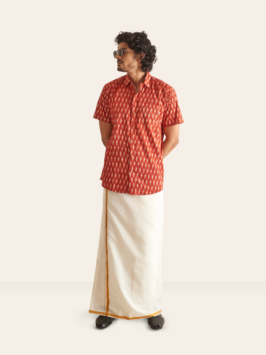 Model Facing sideways wearing Natural Dye Red Ethnic Motif Handblock Printed Cotton Shirt by Brand Patrah