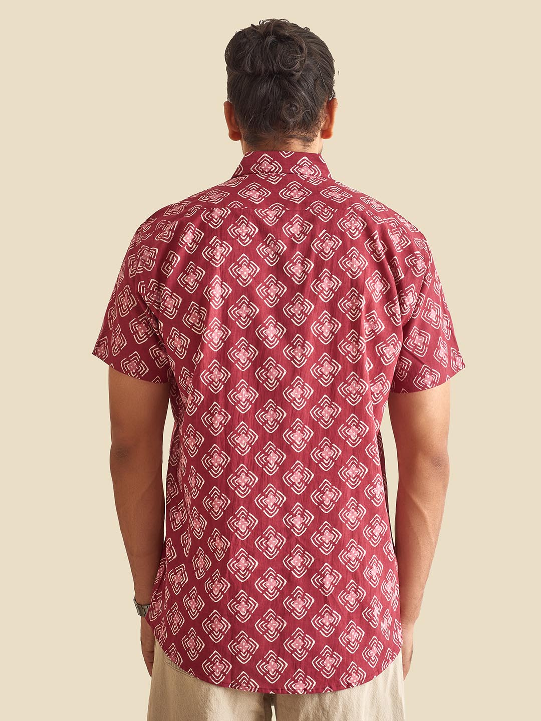 Model facing backwards wearing Plum Abstract Chula Printed Halfsleeves Cotton Shirt by Brand Patrah