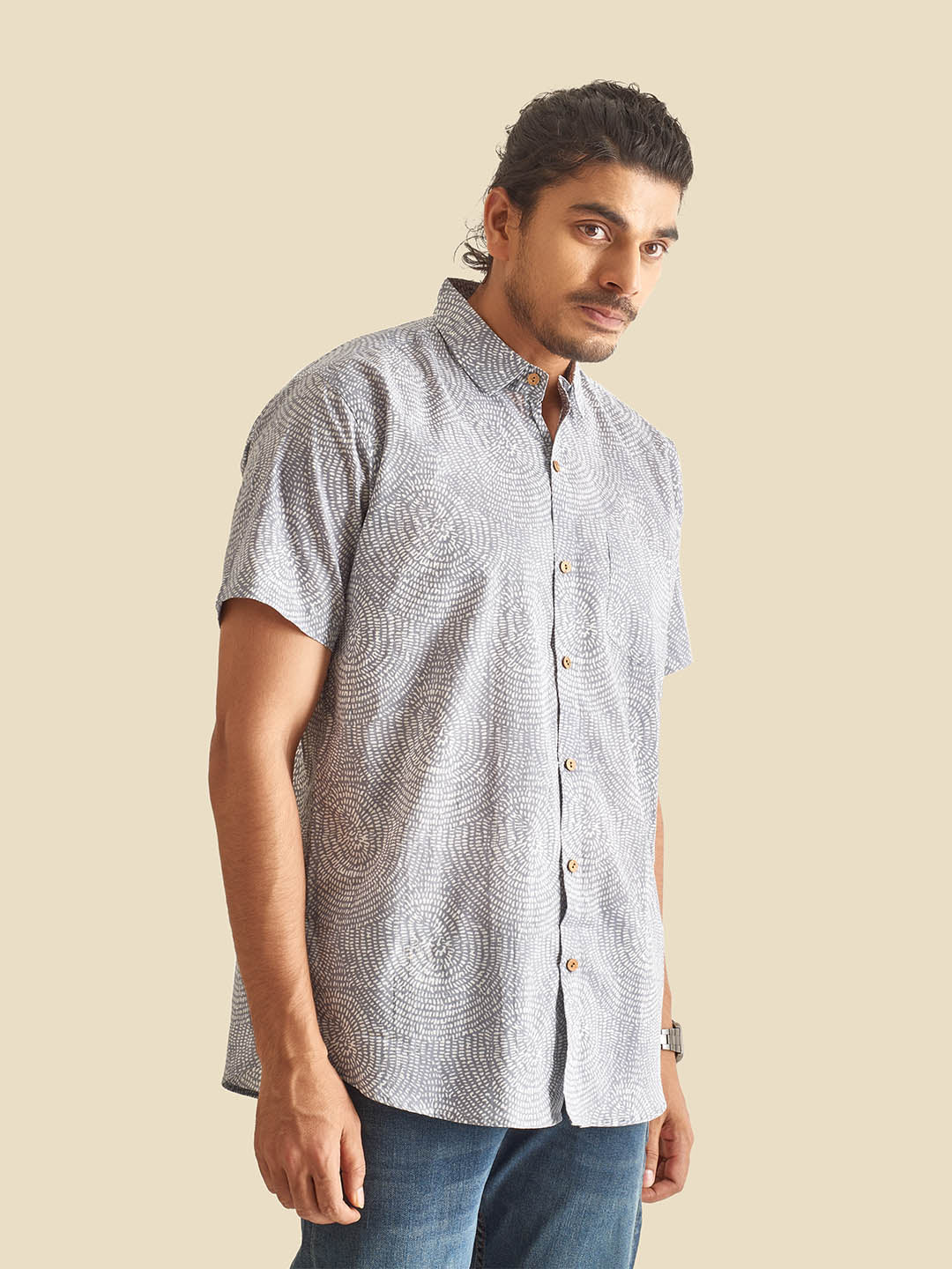 Model Facing sideways wearing Blue Grey Abstract Circles Printed Halfsleeves Cotton Shirt by Brand Patrah