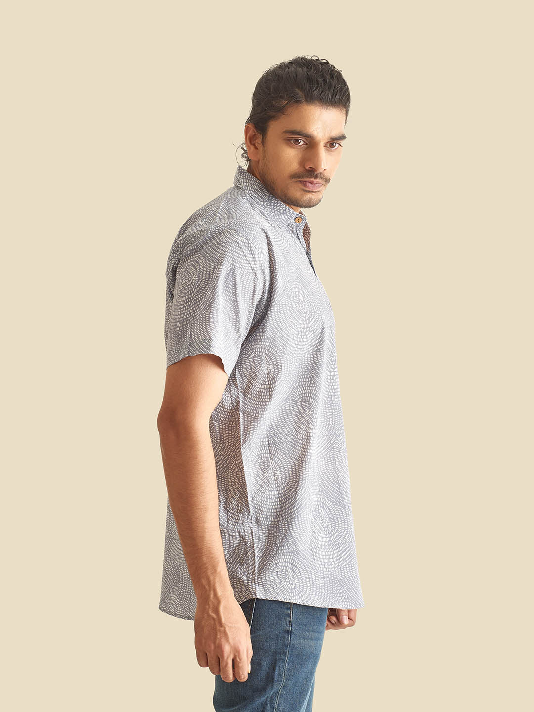 Model Facing sideways wearing Blue Grey Abstract Circles Printed Halfsleeves Cotton Shirt by Brand Patrah