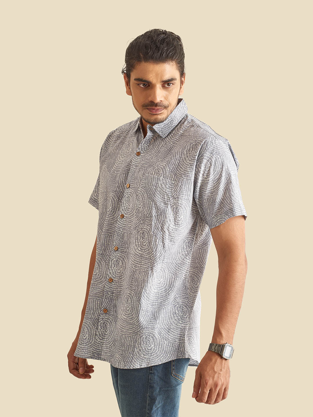 Model Facing sideways wearing Blue Grey Abstract Circles Printed Halfsleeves Cotton Shirt by Brand Patrah