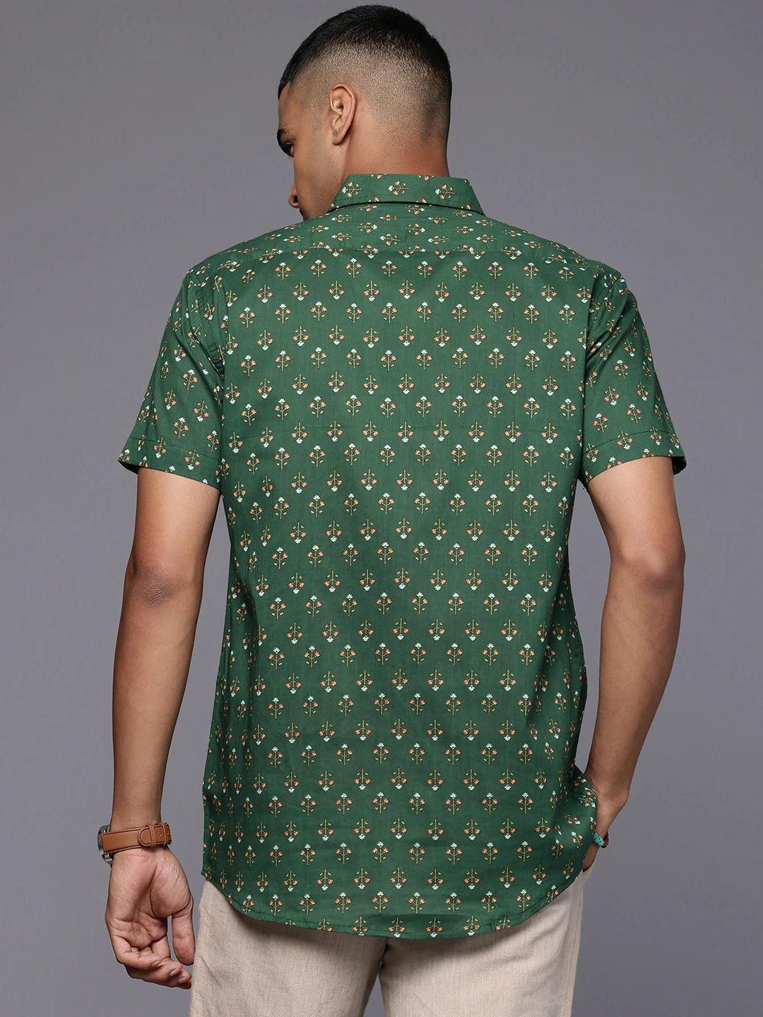 Model facing backwards wearing Emerald Floral Print Cotton Shirt by Brand Patrah