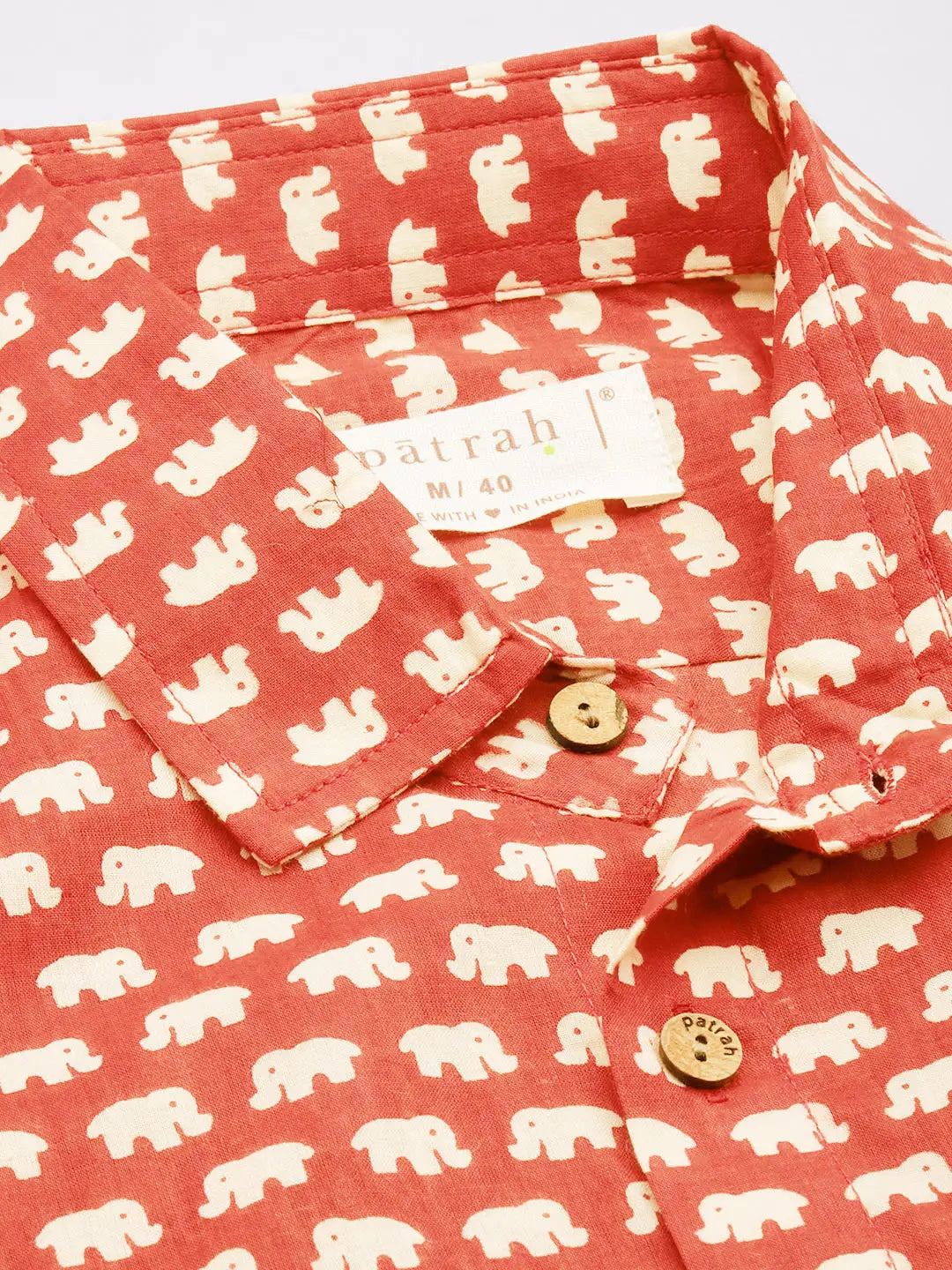 Close up of Red Elephant Print Shirt by Brand Patrah