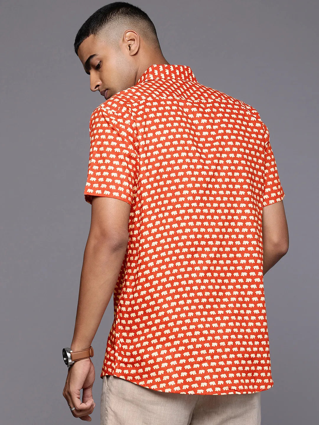 Model facing backwards wearing Red Elephant Print Shirt by Brand Patrah