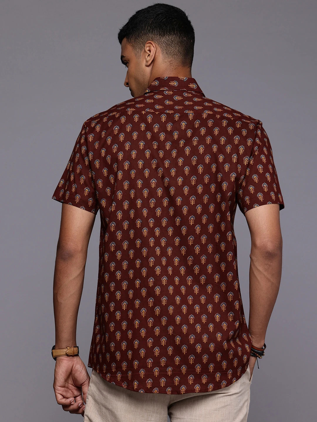 Model facing backwards wearing Maroon Floral Print Shirt by Brand Patrah