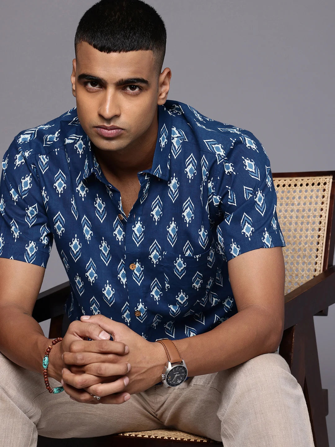 Model sitting in a Blue Ikkat Cotton Shirt by Brand Patrah