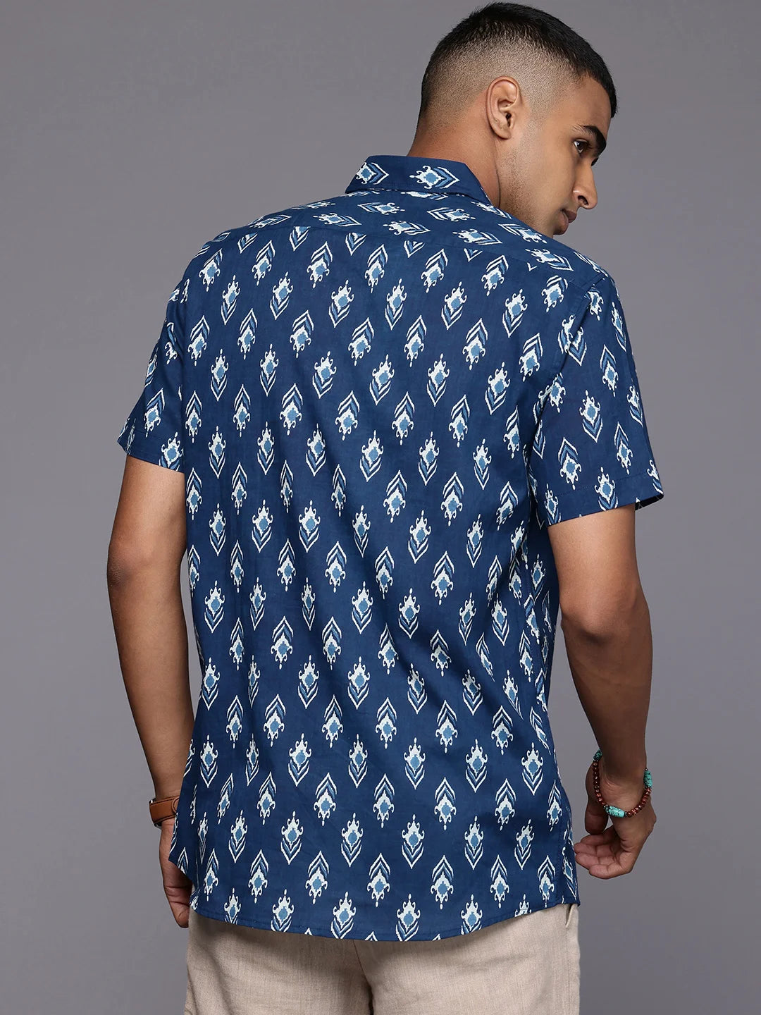 Model facing backwards wearing Blue Ikkat Cotton Shirt by Brand Patrah