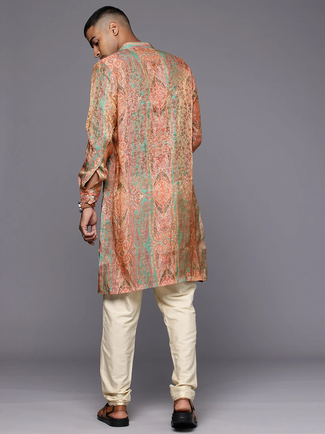 Model facing backwards wearing Paisely Green Abstract Print Silk Kurta by Brand Patrah