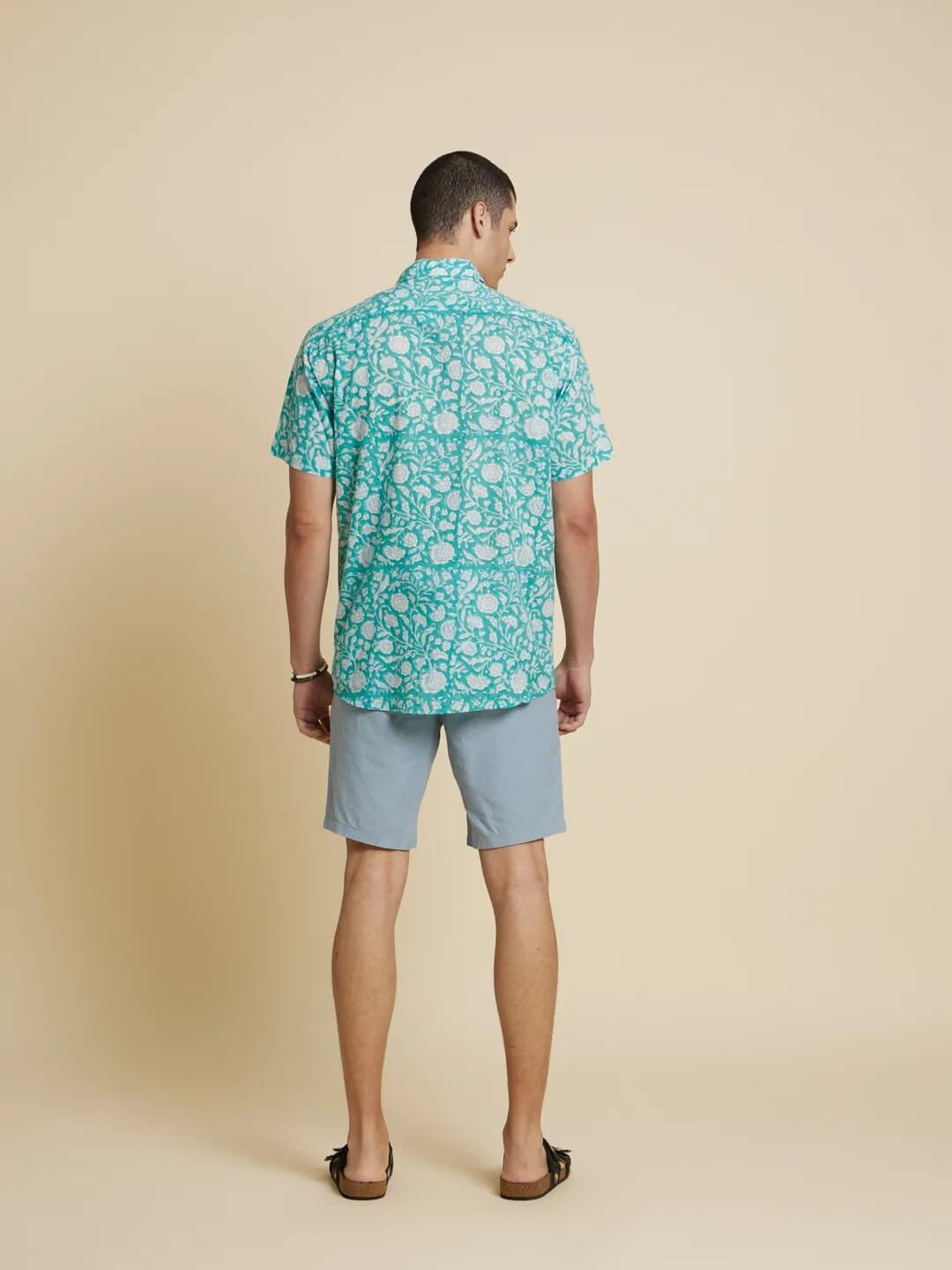 Model facing backwards wearing Botanical Floral Handblock Printed Shirt by Brand Patrah