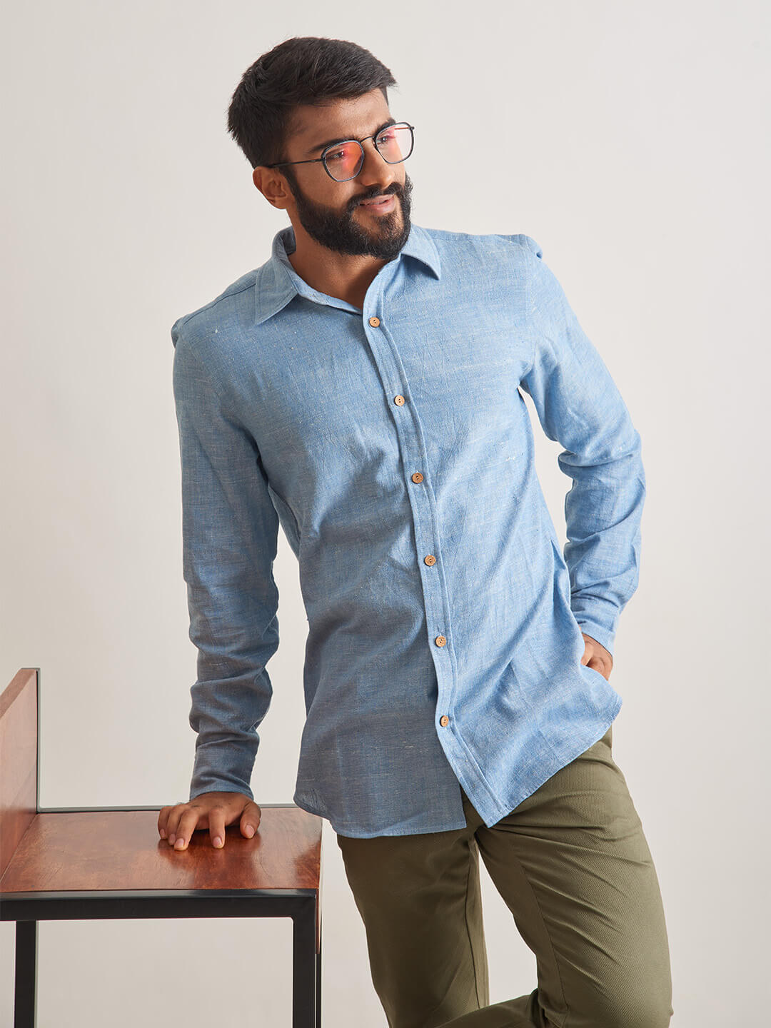 Model Facing sideways wearing Clear Sky Handloom Shirt by Brand Patrah
