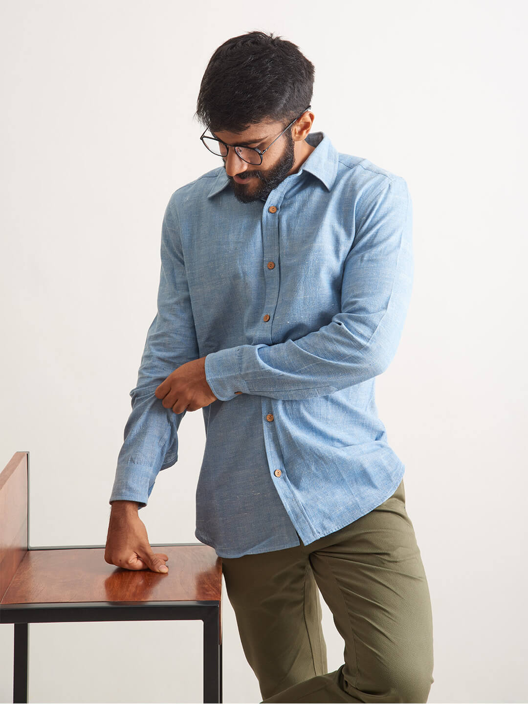 Model Facing sideways wearing Clear Sky Handloom Shirt by Brand Patrah