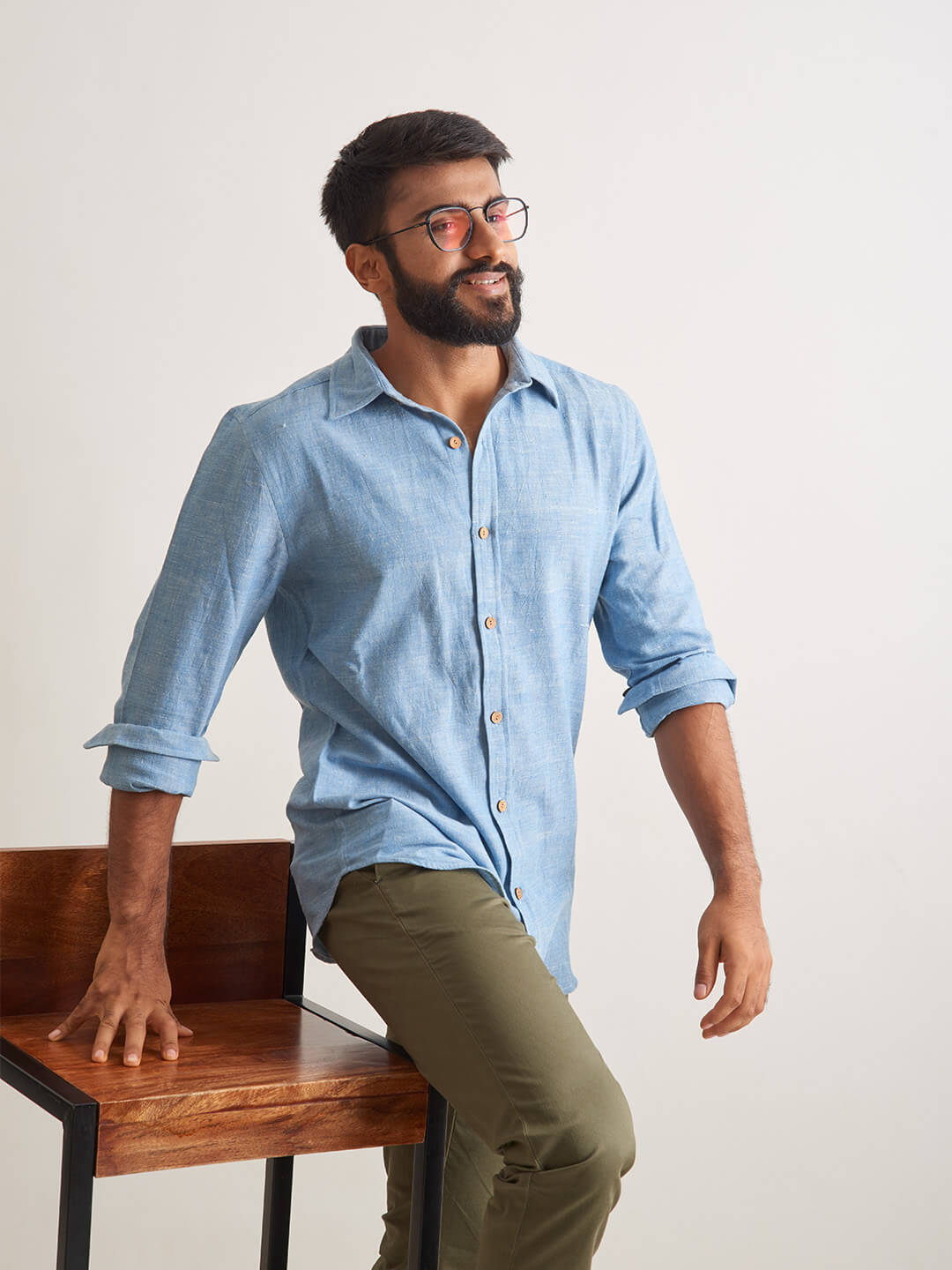 Model Facing sideways wearing Clear Sky Handloom Shirt by Brand Patrah