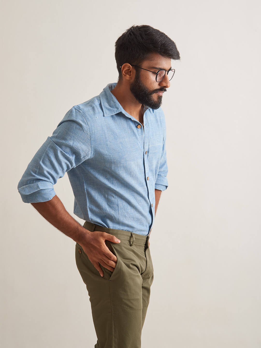 Model Facing sideways wearing Clear Sky Handloom Shirt by Brand Patrah