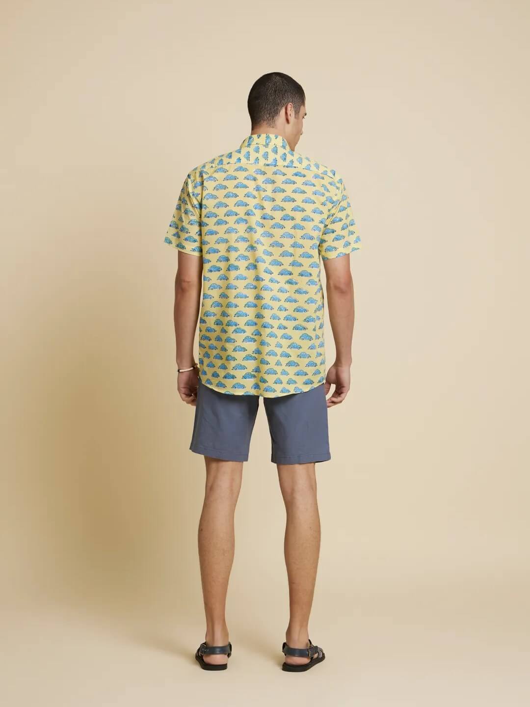 Model facing backwards wearing Green and Blue Car Handblock Printed Shirt by Brand Patrah