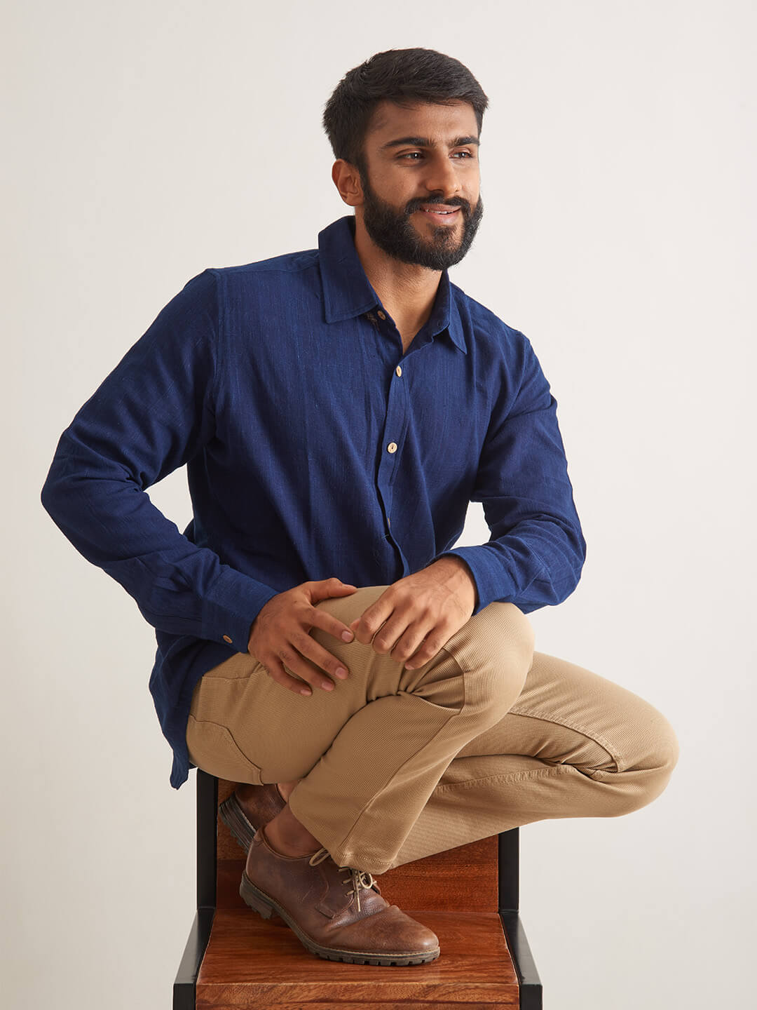Model Facing sideways wearing Indigo Ocean Handloom shirt by Brand Patrah