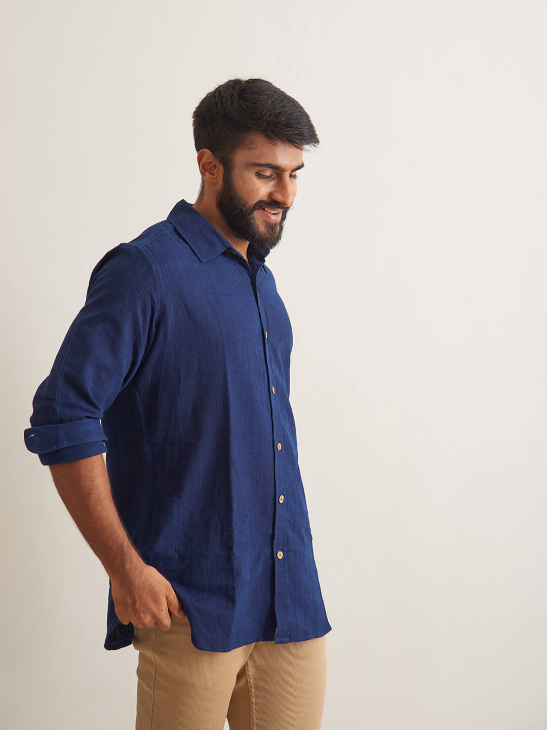 Model Facing sideways wearing Indigo Ocean Handloom shirt by Brand Patrah
