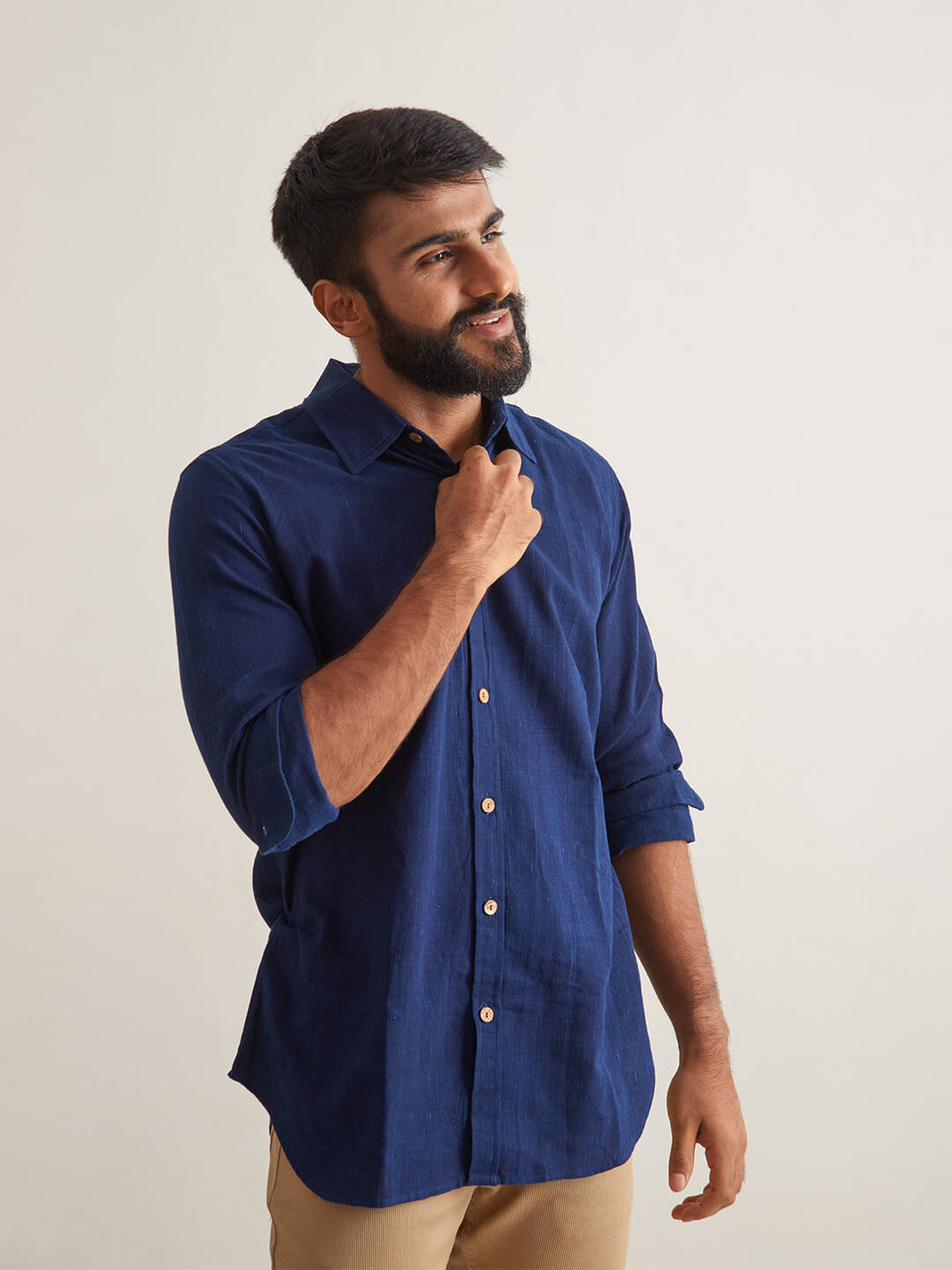 Model Facing sideways wearing Indigo Ocean Handloom shirt by Brand Patrah