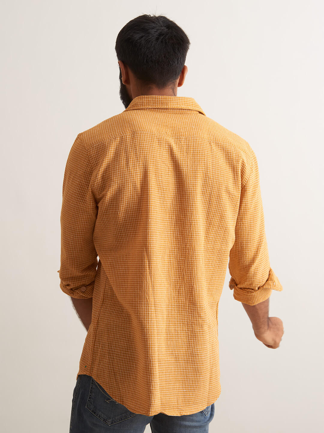 Model facing backwards wearing Mellow Sunrise shirt by Brand Patrah