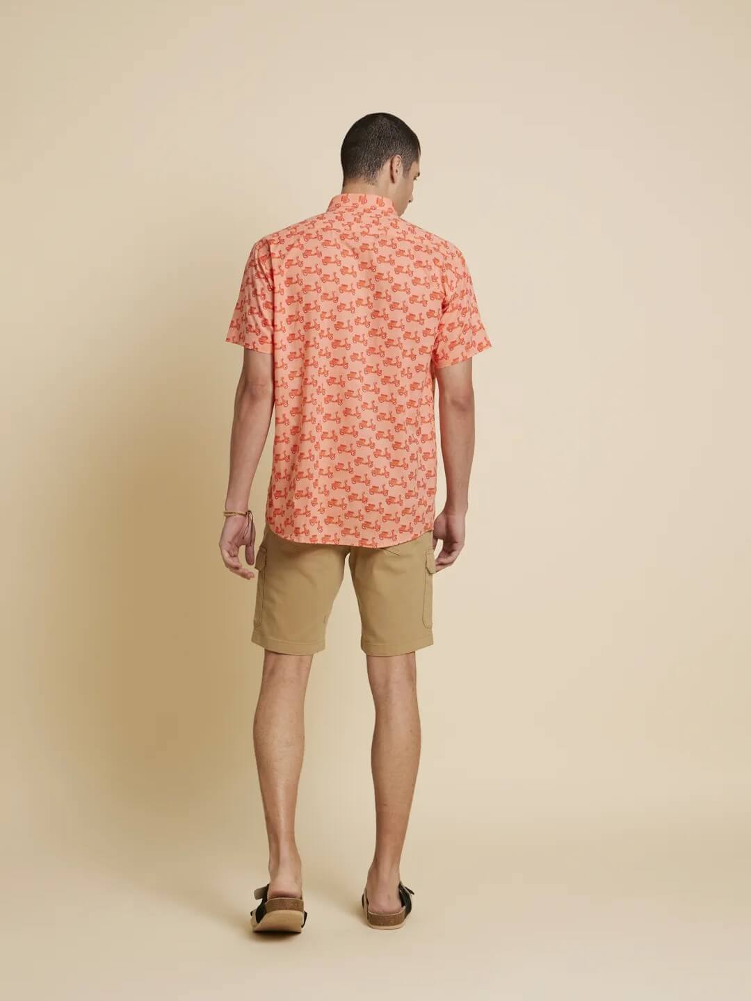 Model facing backwards wearing Peach Orange Scooter Printed Shirt by Brand Patrah
