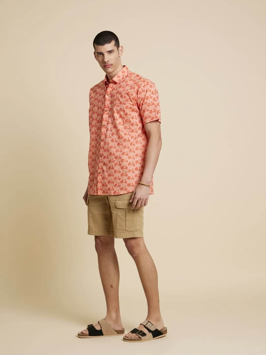 White Model wearing Peach Orange Scooter Printed Shirt by Brand Patrah