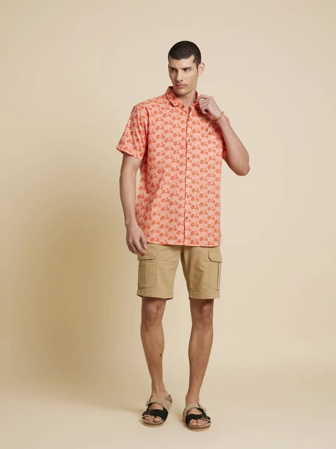 Model Facing sideways wearing Peach Orange Scooter Printed Shirt by Brand Patrah