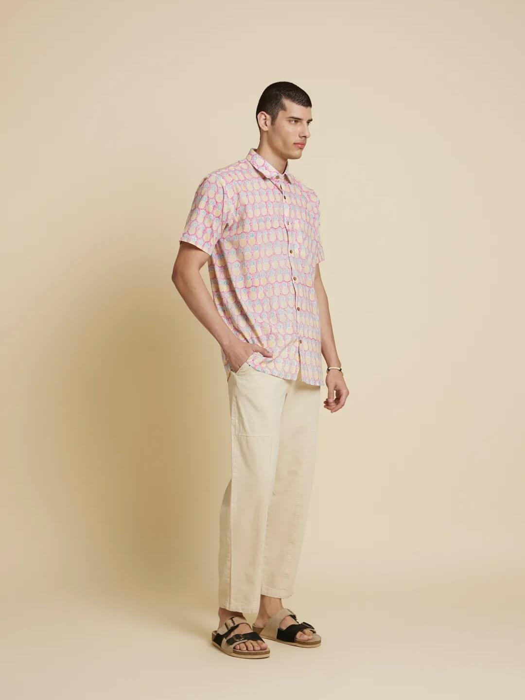 Model Facing sideways wearing Purple Pineapple Handblock Printed Shirt by Brand Patrah
