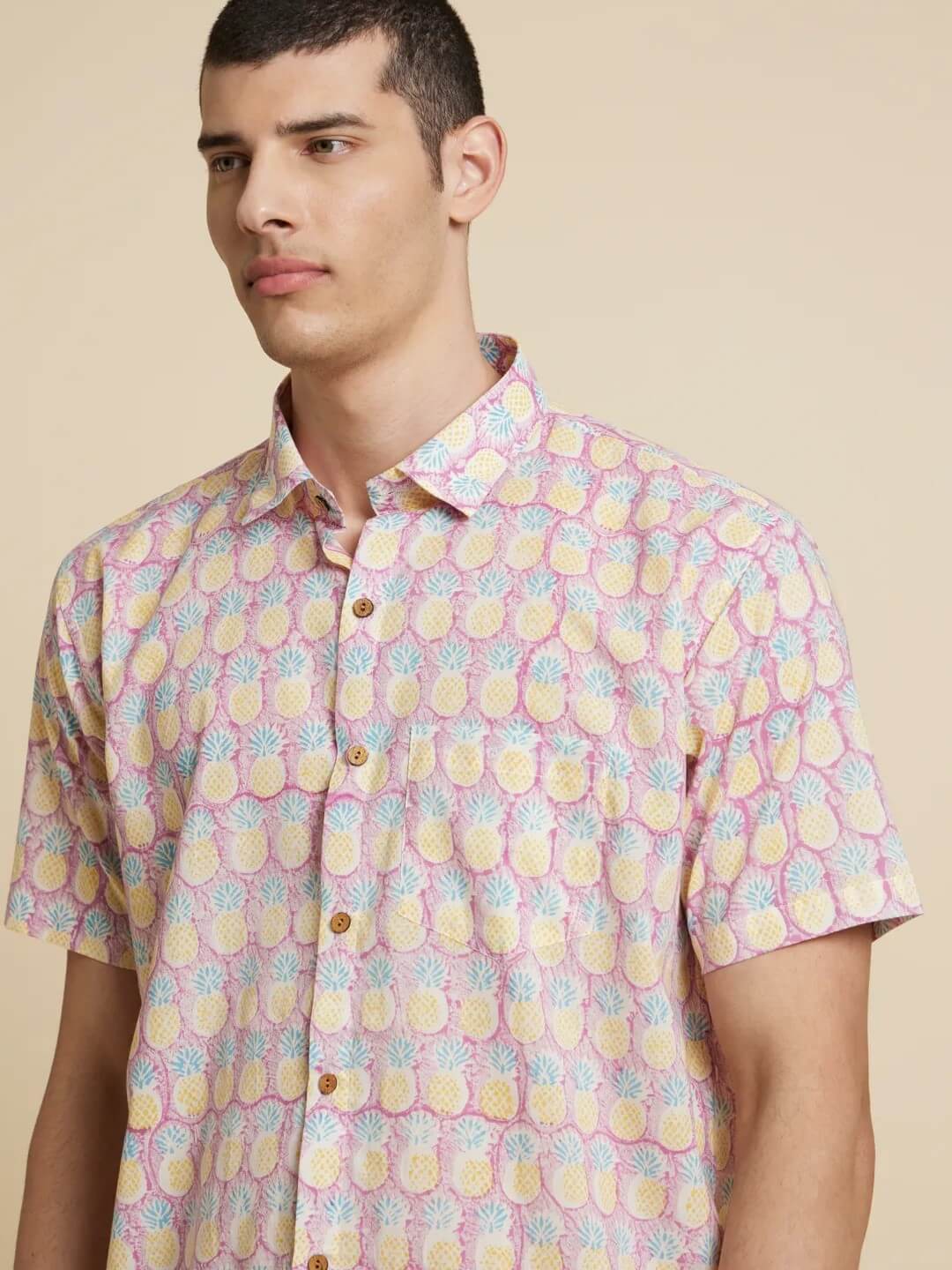 Model Facing sideways wearing Purple Pineapple Handblock Printed Shirt by Brand Patrah
