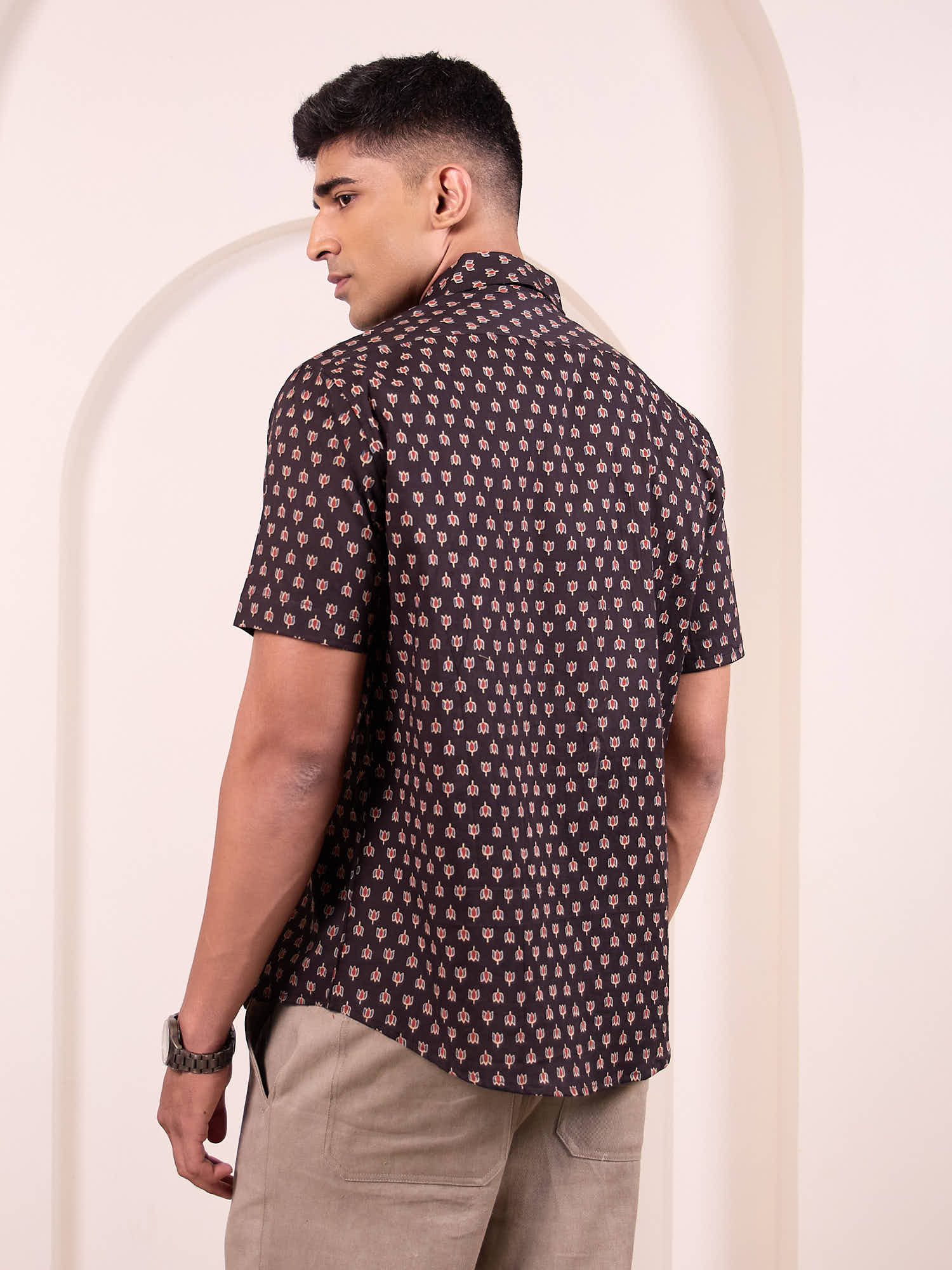 Model facing backwards wearing black lotus ethnic Print Cotton Shirt