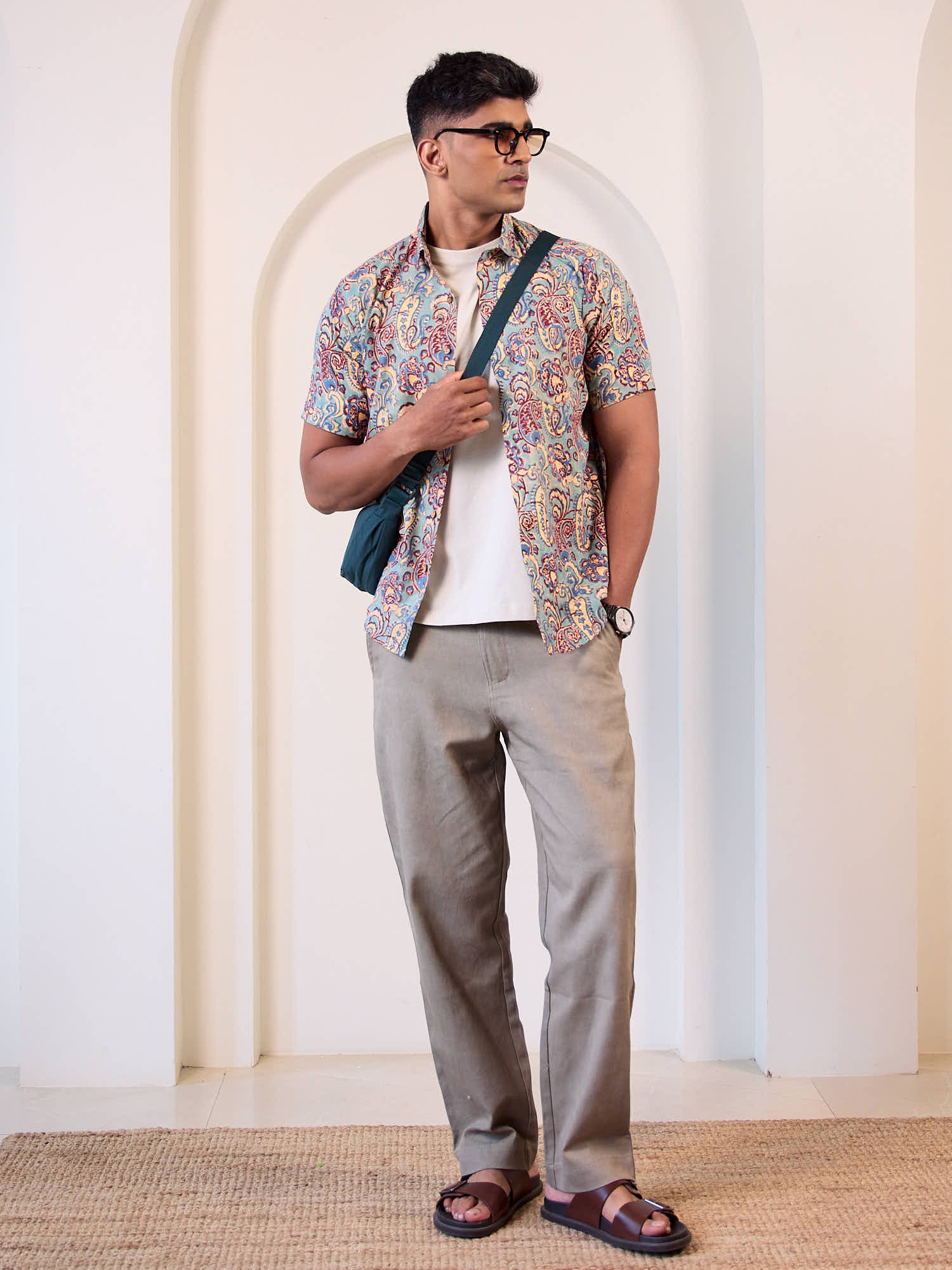 Men model wearing short sleeve  french paisley casual printed shirt with beige trousers