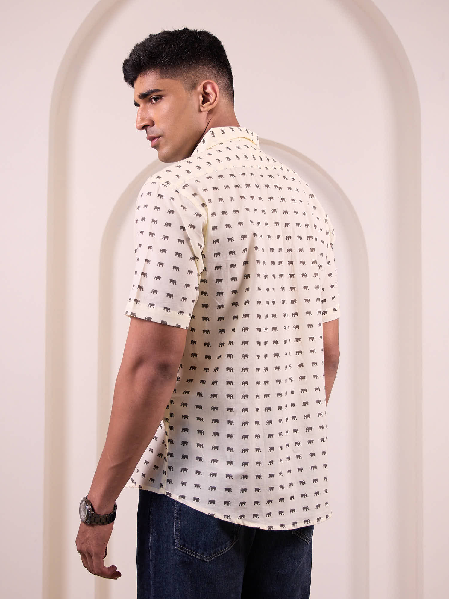 Back view of men’s cotton shirt with animal print for travel styling