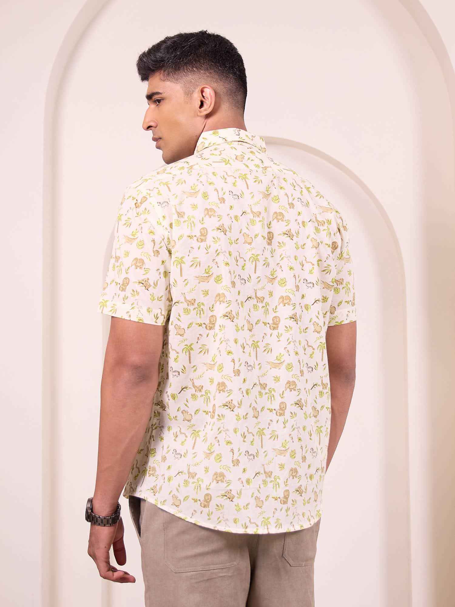 Back view of men’s cotton shirt with safari print for travel styling