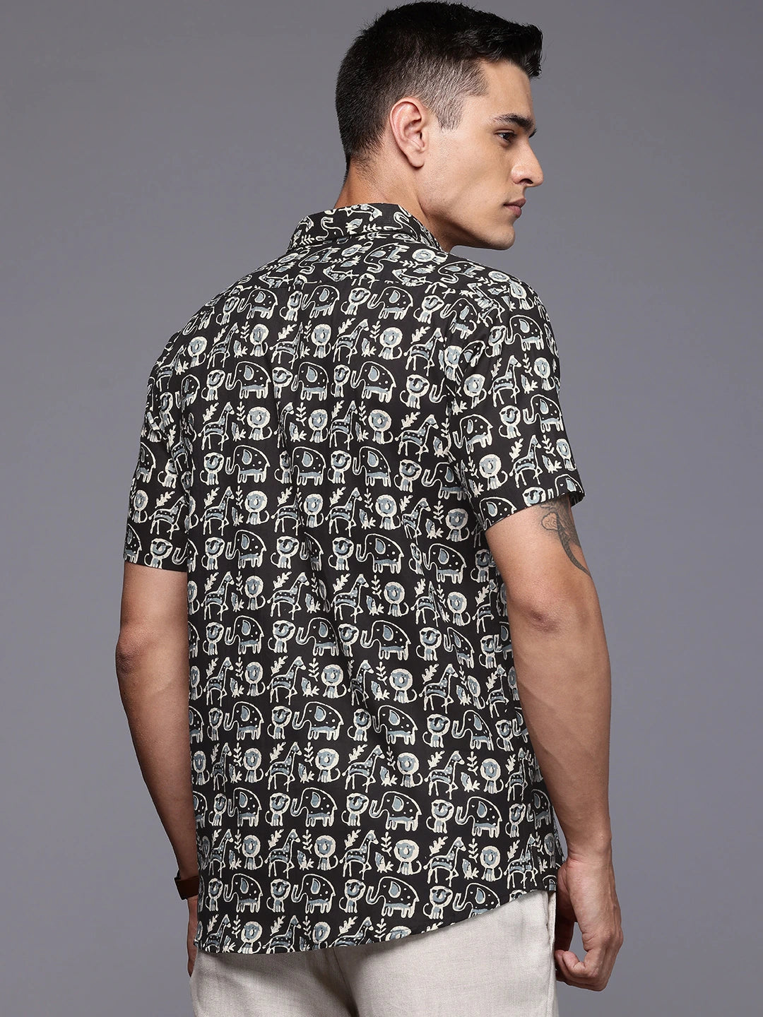 Man wearing a black printed shirt 